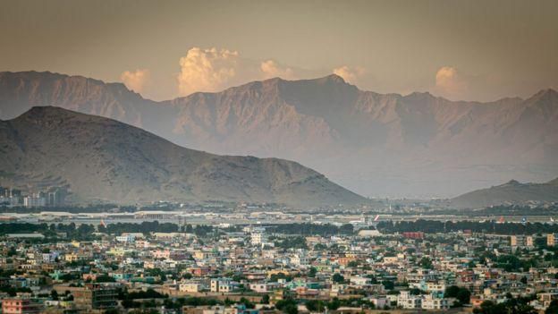 mage captionSunset over the capital Kabul