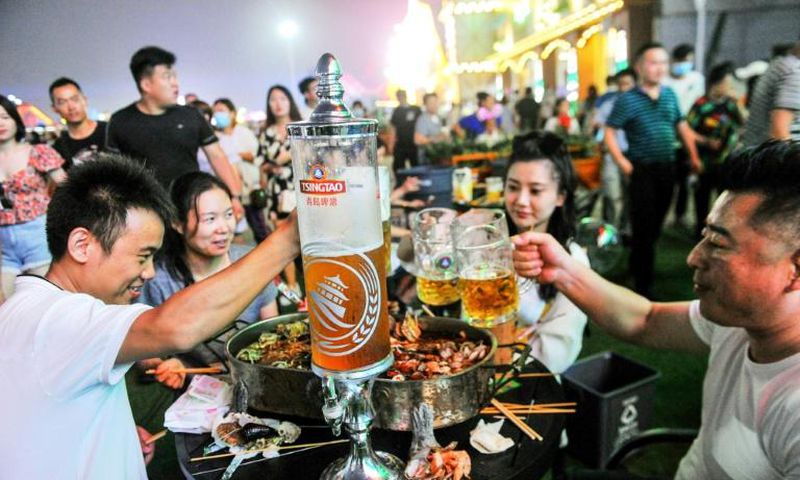 Beer-lovers were reassured by China's low numbers of new virus cases, and turned out to raise a glass