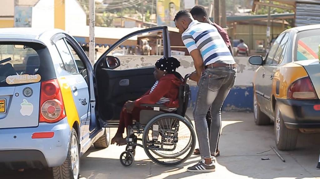 Ghanaian policeman gives to the physically challenged