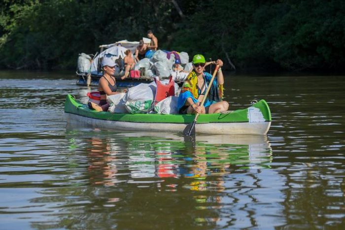 Rafters race down the Tisza River in northeastern Hungary collecting as much rubbish as possible