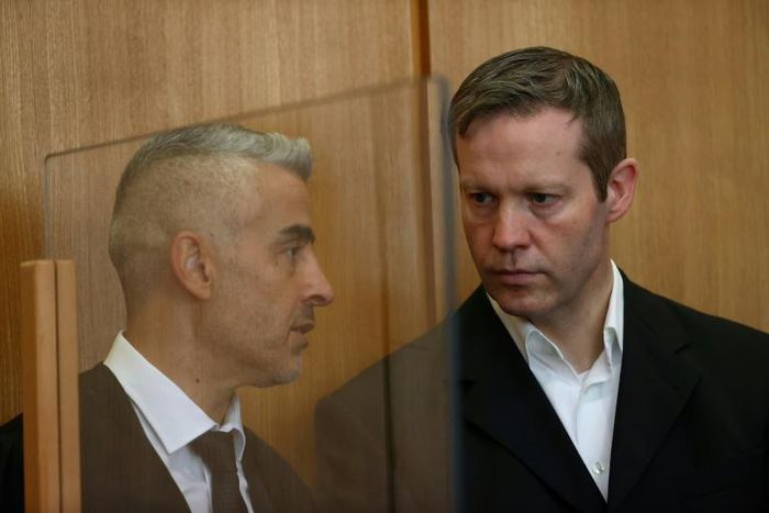 Ernst (R with his lawyer Mustafa Kaplan) said he had carried out a "cowardly and cruel" act