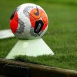 The logo of the English Premier League is pictured on a match ball
