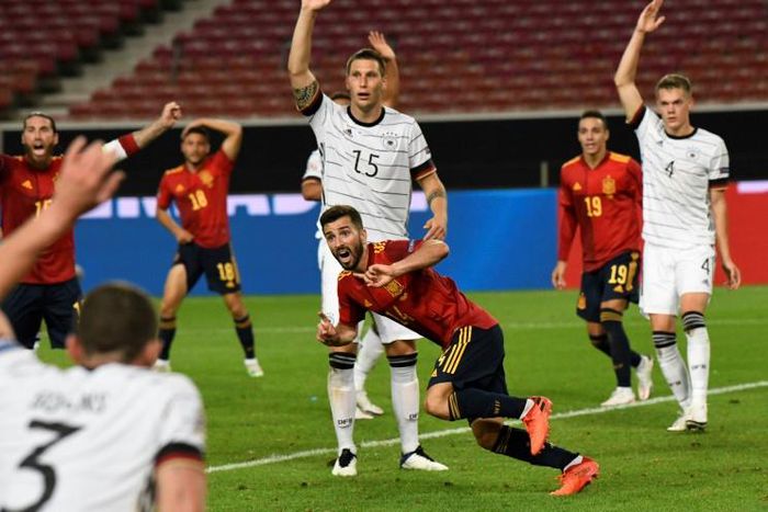 Spain defender Jose Luis Gaya (C) claims a last-gasp equaliser against Germany in Stuttgart on Thursday.