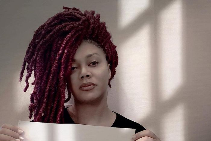 Nadia Buari holds "End SARS" placard