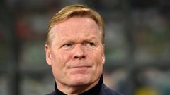 Crisis-hit Barcelona hailed the "return of a legend" as the Spanish giants on Wednesday officially named Ronald Koeman as their new coach through until 2022