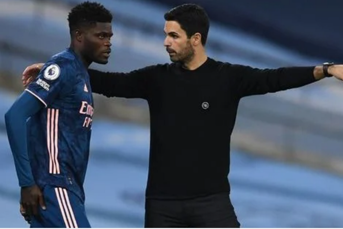 Thomas Partey and his coach Mikel Arteta