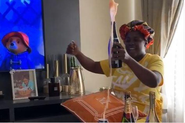 Tracey Boakye pops champagne