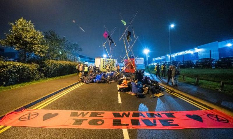 Extinction Rebellion activists disrupt newspaper distribution, claiming the big groups do not report fairly on climate changese the failure of these corporations to accurately report on climate change and what should be done to halt it