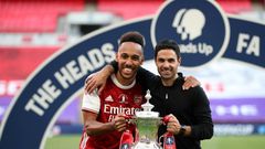 Mikel Arteta (right) is confident Pierre-Emerick Aubameyang (left) will remain at Arsenal