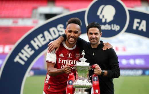 Mikel Arteta (right) is confident Pierre-Emerick Aubameyang (left) will remain at Arsenal