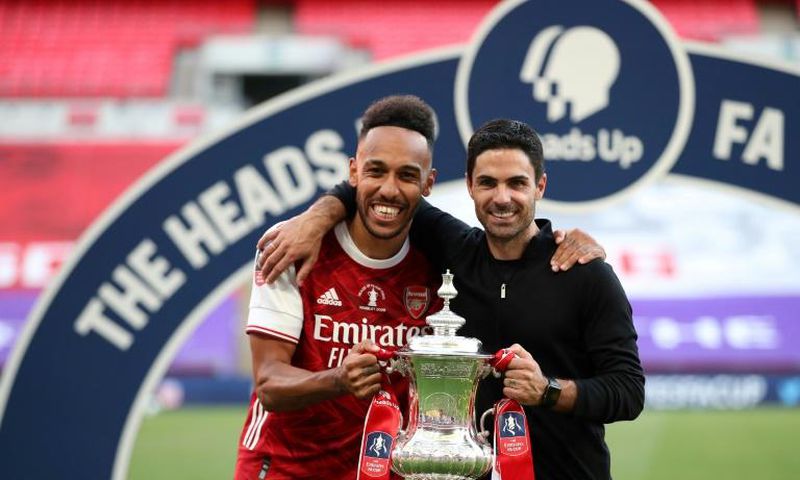 Mikel Arteta (right) is confident Pierre-Emerick Aubameyang (left) will remain at Arsenal