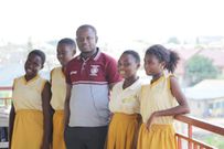 Teacher Bossman Godfred Makafui with pupils