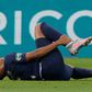 Kylian Mbappe clutches his right ankle after a foul by Loic Perrin in the French Cup final