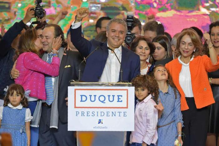 Colombian President Ivan Duque (center) -- seen here celebrating his election victory in June 2018 alongside his family -- is now under investigation for alleged campaign finance violations