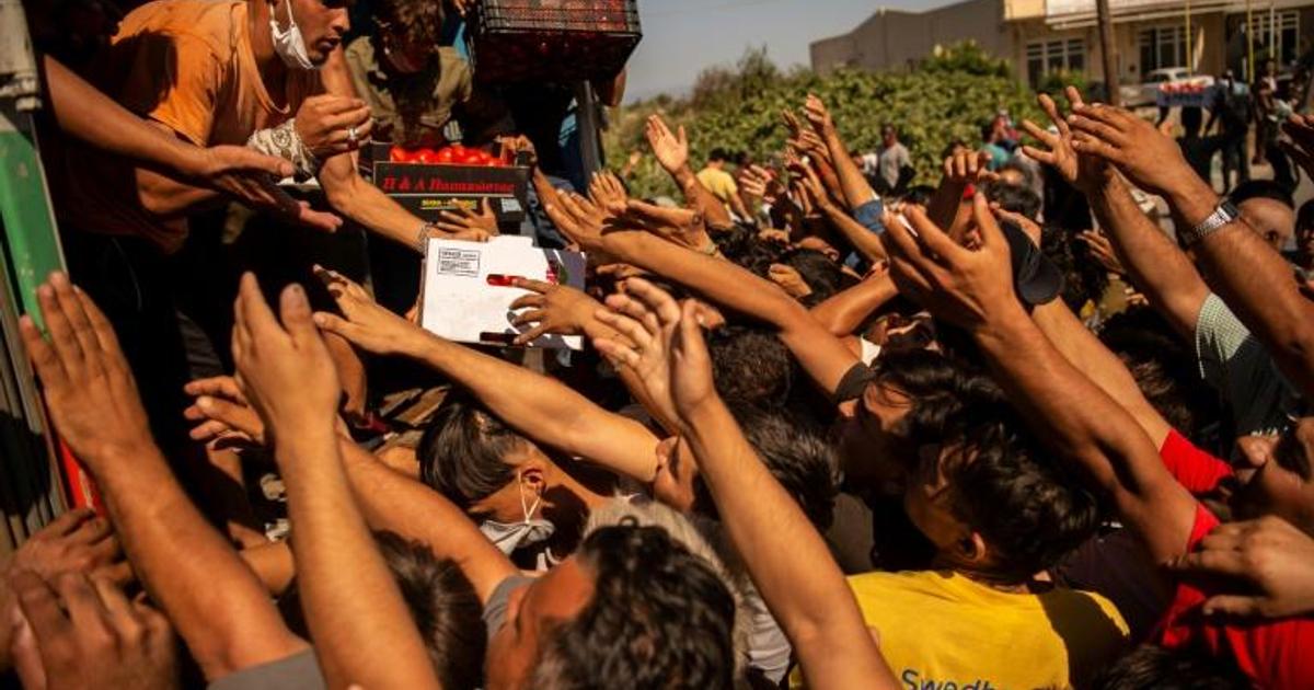 Migrants still homeless after Greek fire as police boost presence