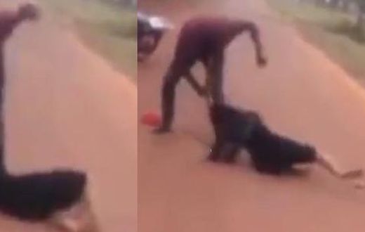 Man beats up a woman in the middle of the road