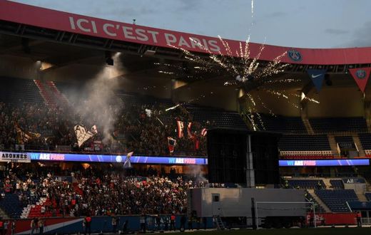 Fans gathered behind the goal to watch on a big screen