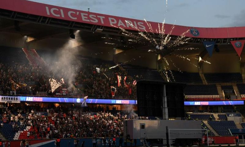Fans gathered behind the goal to watch on a big screen