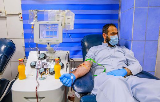 A recovered coronavirus (COVID-19) patient donates blood samples for plasma extraction to help critically ill patients at the National Blood Transfusion Center.