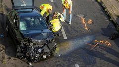 The mangled black Opel Astra on Berlin's Autobahn 100 after its driver caused three accidents