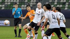 Aaron Mooy (centre) said he hadn't been expecting to make his debut for Shanghai SIPG on his 30th birthday, but then scored with a cool finish to celebrate