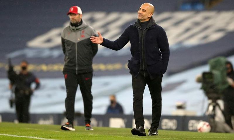 Manchester City boss Pep Guardiola (right) and Liverpool boss Jurgen Klopp shared the spoils in a 1-1 draw at the Etihad