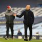 Manchester City boss Pep Guardiola (right) and Liverpool boss Jurgen Klopp shared the spoils in a 1-1 draw at the Etihad