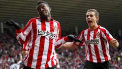 Asamoah Gyan and Jordan Henderson