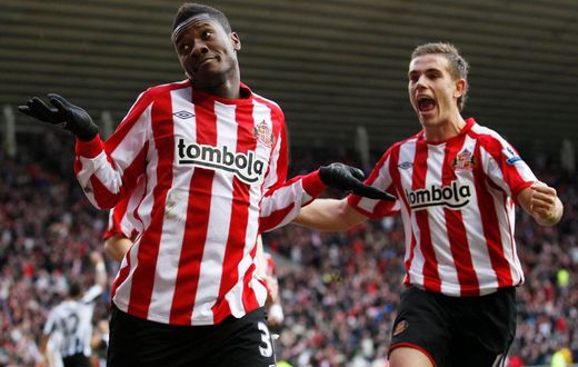 Asamoah Gyan and Jordan Henderson