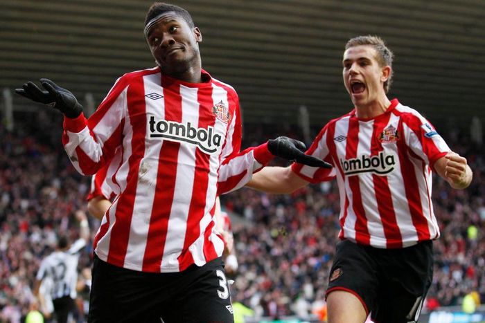 Asamoah Gyan and Jordan Henderson