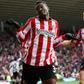Asamoah Gyan and Jordan Henderson