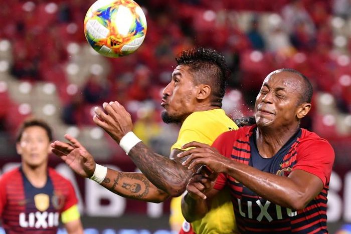 Brazil midfielder Paulinho (C) is a major force for Guangzhou Evergrande
