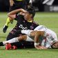 Los Angeles FC star Diego Rossi (white) is fouled by Seattle defender Xavier Arreaga which resulted in a penalty goal as the LAFC advanced to the quareter-finals with a 4-1 win over the reigning MLS champions in Florida