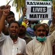 Protesters in Karachi shout slogans during a rally to show solidarity with people of Indian-administered Kashmir on August 5