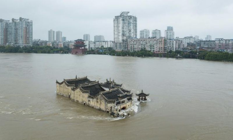 The Guanyinge temple, a 700-year old structure built on a rock in the Yangtze River in Wuhan, is surrounded by flood water