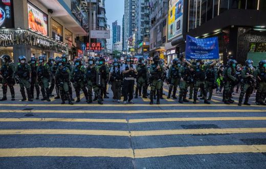 Police patrol after protesters rallied in Hong Kong to protest against the government's decision to postpone the legislative council elections