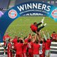 The Bayern Munich squad throw head coach Hansi Flick in the air after winning the Champions League final.