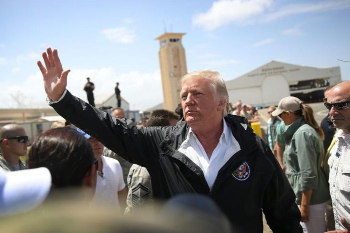 Donald Trump waves to a crowd during a 2017 visit to Puerto Rico, which the US president is accused of wanting to sell