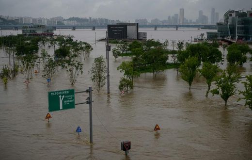 The Han river burst its banks in some places, causing flooding in South Korea