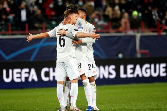 Joshua Kimmich celebrates with team-mates after scoring Bayern Munich's stunning winner in Moscow last week