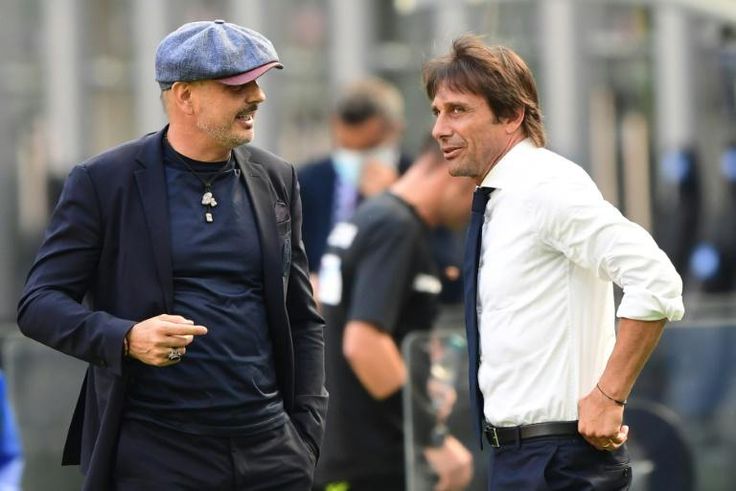 Bologna coach Sinisa Mihajlovic (L) talks with Inter Milan's Antonio Conte before a Serie A match behind closed doors in the San Siro.