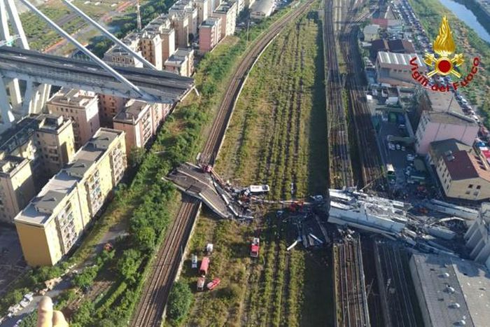 Dozens of cars and several trucks crashed onto railway tracks when the Morandi motorway bridge collapsed in August 2018 killing 43 people