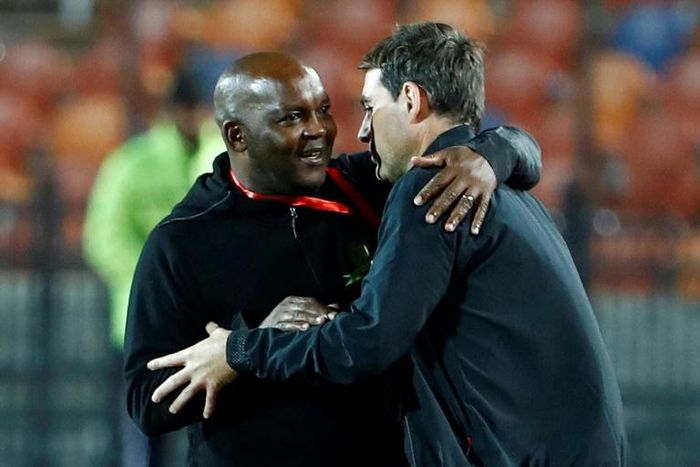 Coaches Pitso Mosimane (L) of Mamelodi Sundowns and Rene Weiler of Al Ahly meet after a CAF Champions League quarter-final first leg in Cairo this year.