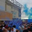 Leeds United supporters gather outside their Elland Road ground to celebrate promotion