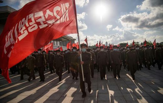 Members of a 12,000-strong volunteer workforce attend a rally to pledge support for a typhoon recovery campaign ordered by North Korea's leader Kim Jong Un at the Kumsusan palace in Pyongyang