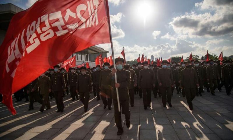 Members of a 12,000-strong volunteer workforce attend a rally to pledge support for a typhoon recovery campaign ordered by North Korea's leader Kim Jong Un at the Kumsusan palace in Pyongyang