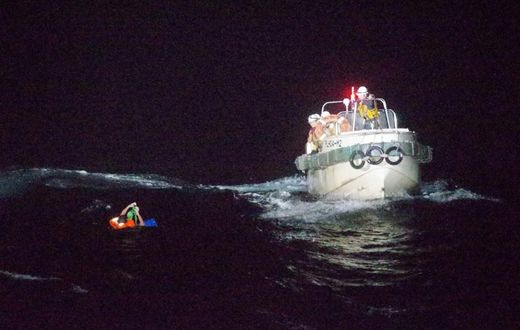 Dramatic photos released by Japan's coast guard showed the rescue of one survivor from a ship that sank during a typhoon