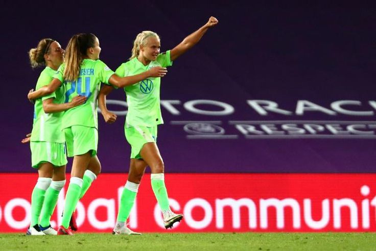 VfL Wolfsburg's Danish forward Pernille Harder (R) celebrates with teammates their team's victory at the end of the UEFA Women's Champions League semi-final football match between VFL Wolfsburg and FC Barcelona at the Anoeta stadium in San Sebastian on...