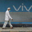 A pedestrian walks past an advert for Chinese mobile phone maker VIVO in Mumbai
