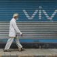 A pedestrian walks past an advert for Chinese mobile phone maker VIVO in Mumbai